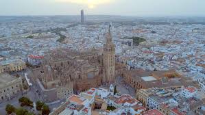 And we're only just getting started. Seville City From The Air Pull Back Drone Aerial Stock Photo Video Footage