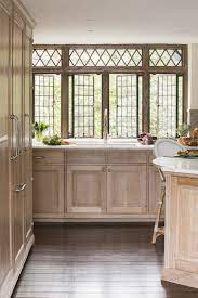 The white oak wood is cut perpendicular to the annular rings (a process known as 'quarter sawing'), showing beautiful reflective spots called 'flecks' that produce a dramatic effect. We Custom Built The Quarter Sawn And Rift White Oak Cabinetry For This Kitchen By Sarah Blank Design Studio White Oak Kitchen Oak Cabinets Home