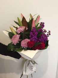 Bouquet of flowers on a green background. Red Purple Pink Flower Bouquet Frances Dunn Florist