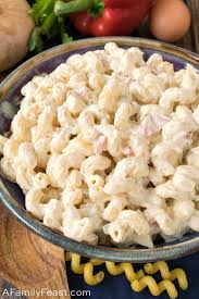 Macaroni salad is a type of pasta salad, served cold made with cooked elbow macaroni and usually prepared with mayonnaise. Macaroni Salad A Family Feast