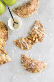 These Baked Apple Pie Empanadas With A Buttery Brown Sugar Apple Filling And A Spiced Rum Icing Dri Sweet Recipes Desserts Baked Apple Pie Best Dessert Recipes