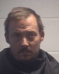 Two charged for having heroin, guns