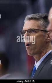 Ottawa Senators head coach Dave Cameron, left, leads a practice at the  Canadian Tire Centre in Ottawa with player David Legwand