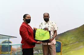 Cecil Calliste donates laptops to students at USC