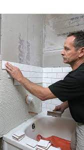 Liquid nails and epoxy adhesives allow for adhesion to plastic, and if you have a rounded tub, use mosaics or pebbles and other small tiles to wrap the curves. Perfecting The Tiled Tub Surround Fine Homebuilding