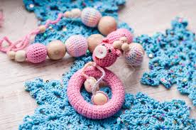 Check spelling or type a new query. Necklace Made From Knitted Pig And Toys For The Baby Sitting In A Sling Sling Necklace Stock Photo Picture And Royalty Free Image Image 115379523