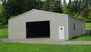 This building features a charcoal gray roof, light stone walls, and saddle tan trims. 40x50 Metal Building 40x50 Steel Garage Building