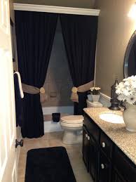 Shutters mounted inside the window frame can be closed at will, while a loose valance that matches the gray veins of marble embellishes the bathroom window glass. Tie Back Shower Curtains Ideas On Foter