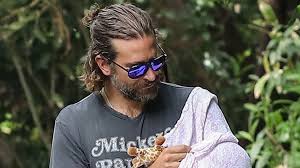 Want to know how bradley cooper has worn his hair?? Bradley Cooper S Man Bun Is Dad Hair Done Right Vogue