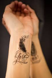 'too beautiful for earth' tattoo. 25 Impressive Feather Tattoo Designs