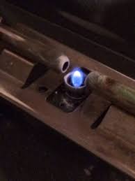 Set the oven's temperature to off, remove the stove's oven control knob, and push in on the metal control rod there while holding a lighter under that sprinkler head— this should cause the pilot to light. Do Stoves Have Pilot Lights Quora