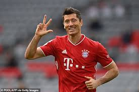 Robert lewandowski bayern munich celebration picture frame wall art rollerswallart. Robert Lewandowski Celebrates His Remarkable 2020 By Posing In Bed Alongside The Trophies He S Won Daily Mail Online
