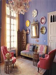 Characterized by intricate carvings, arched doorways, and colorful fabrics, it should come as no surprise that moroccan interior design has become quite popular around the world. Moroccan Home Decor With Handmade Wall Decorations And Colorful Moroccan Furniture Upholstery Fabr Moroccan Living Room Eclectic Living Room Purple Living Room