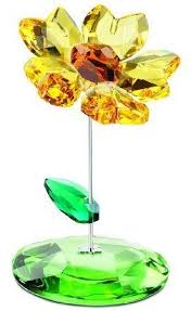This fresh and summery sunflower design will brighten up any interior and, as a symbol of adoration and dedication, makes a. Swarovski Crystal Figurine Joy Rocking Flower Swarovski Crystal Figurines Swarovski Crystal Ornament Crystal Figurines