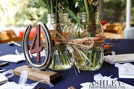 The Many Uses Of Mason Jars Western Wedding Centerpieces Themed Wedding Decorations Western Themed Wedding