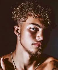 Curly Haired Blue Eyed Black Man Curly Hair Styles Black Curly Hair Blue Eyes