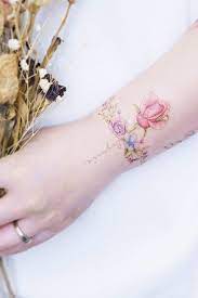 The pair of scissors and pink ribbon are a cute way to depict her profession. Wrist Dainty Rose Tattoo Novocom Top