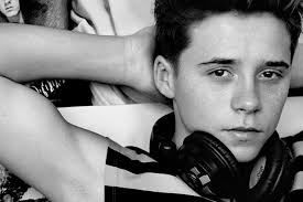 Brooklyn poses as a Man About Town