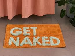 Essential bath mat with printed text, designed exclusively for urban outfitters. Urban Outfitters Sells Get Naked Bath Mat And Now We Feel Dirty Inside Too Can We Cancel Them Yet
