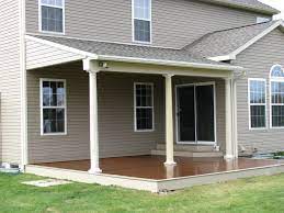 There are many advantages to a roof over your deck, such as: Compiste Deck With A Partial Roof Supported By Tapered Columns Concrete Patio Patio Roof Outdoor Blinds