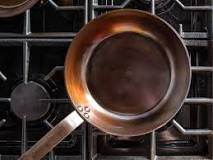 How do you season a carbon steel pan on the stove top?