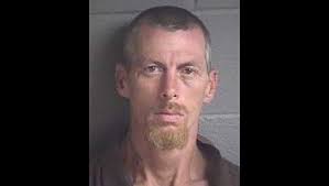 Man arrested for killing man at campsite behind business, police say