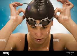 Adjusts her goggles hi-res stock photography and images