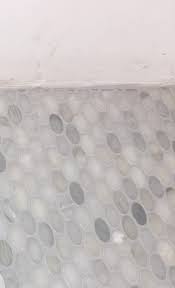 If it does turn white again and you seal it you are still going to have water penetrate the marble along all the edges through the grout. White Marble Turned Gray