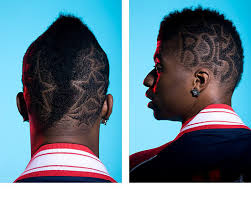 A platinum hawk stands out against dark hair and the line is echoed in the high low fade. Mohawk Hairstyles For Black Men Afroculture Net