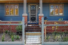 The fence is made of wire slightly thicker than a coathanger that is welded together creating rows and columns of rectangles. Heritage Woven Wire Gates