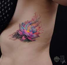 Freehand Watercolor Lotus Flower Done On Girls Side By Alberto Cuerva An Artist Working In South Watercolor Lotus Tattoo Beautiful Tattoos Lotus Tattoo Design