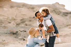 Wedding makeup artist making a make up for bride. Happy Casual Caucasian Wife And Black Smiling Husband Playing With Cute Children On Nature At Daytime Modern Baby Boy Stock Photo 326085780