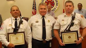 2 firefighters honored for saving boy from burning home