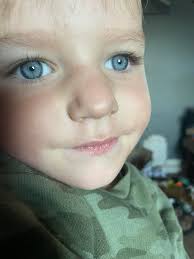 Do we think her eyes are grey or blue?