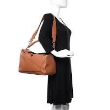 We did not find results for: Loewe Calfskin Large Puzzle Bag Tan 514258 Fashionphile