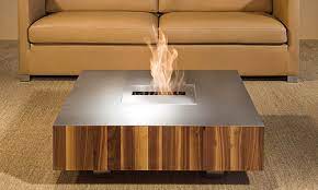 The individual wooden panels are expertly designed and the practical shelf space is accessible from both sides. Wooden Coffee Tables With Sliding Top And Burner Kit By Schulte Design