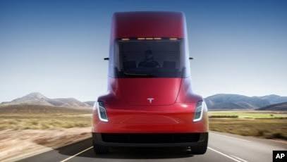 Tesla Presents Electric Truck, Updated Sports Car