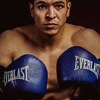 A man standing next to another man in a boxing ring. Boxing boxer fitness,  sports.