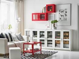 A White Living Room With A Two Seat Sofa And A Low Storage Combination With Open And Closed With Images Ikea Living Room Living Room Storage Living Room Storage Solutions