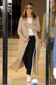 White jeans and a tank get a boost from tan wedge. Jennifer Aniston Is Casual In Paris In A Camel Coat Daily Mail Online