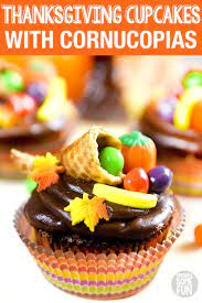 Turkeys are a popular choice, but pilgrim hats and pumpkins are also traditional choices. Thanksgiving Cupcakes With Cornucopia Toppers In 2020 Thanksgiving Desserts Table Thanksgiving Desserts Kids Thanksgiving Cupcakes