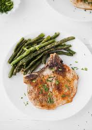 Pork loin chops, seasoned with paprika, sage, thyme and spices then lightly pan fried and served with homemade applesauce. Oven Baked Bone In Pork Chops Recipe Cooking Lsl