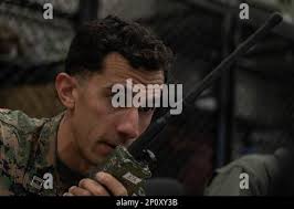 Air Force JTAC officer, Capt. Skylar Jackson of the Joint Multinational  Readiness Center Bullseye Team checks grid coordinates