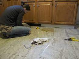 Currently the tiles are installed underneath my cabinets. Tips For Installing A Kitchen Vinyl Tile Floor Merrypad