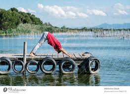 Find & download the most popular yoga sea photos on freepik free for commercial use high quality images over 10.yoga sea photos. Fit Man Improving Balance While Doing Natarajasana Yoga Pose On Sea Embankment A Royalty Free Stock Photo From Photocase