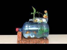 A Fish Tank Makes An Eye Catching Feature In A Room Check Out This Article For 27 Small Fish Tank Ideas To Compl In 2021 Diy Fish Tank Diy Aquarium Plastic Bottle Art