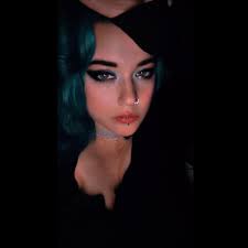 Female tattoo artist specializing in realism and fine lines