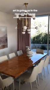Mandy Moore S New Dining Room Burl Wood Dining Table White Dining Chairs Modern Chandelier Light Fixture White Dining Chairs Dining Table Wood Dining Table
