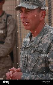 U.S. military personnel of 2nd Battalion, 2nd Marine Regiment, RCT-5, and  Police Transition Team 7 receive a visit from a senior military commander  at Camp Gannon II, Anbar province, Iraq, to assess