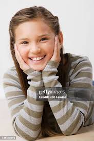 Portrait Of Girl Lying On Hardwood Floor At Home Romania High-Res Stock  Photo